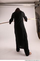 Man Adult Average White Fighting with spear Standing poses Coat